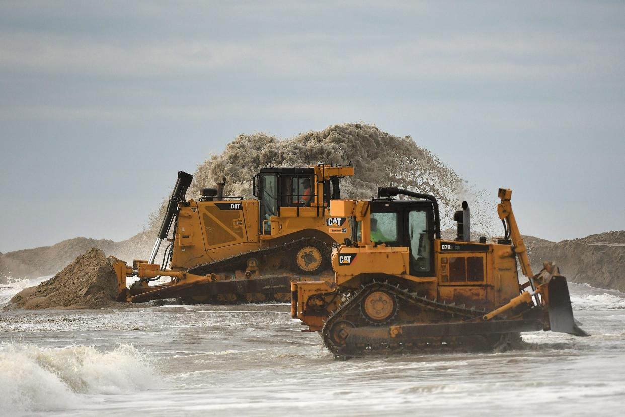 Crews work to nourish Wrightsville Beach in late January. The $13.6 million federal project wrapped up in March. The New Hanover County beach town gets a fresh injection of sand on its beach every few years.