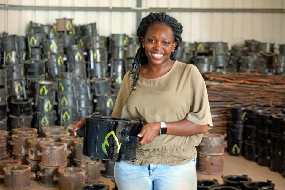 Charlot Magayi with one of her Mukuru Clean Stoves (PA)