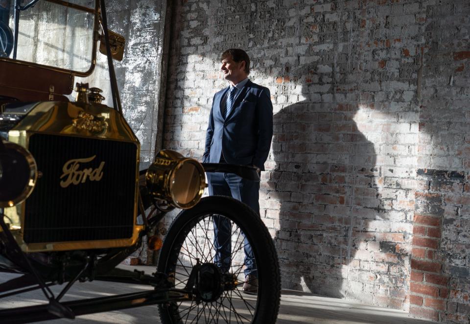 Ford Motor Co. CEO Jim Farley stands in a room with Model T vehicles at the Ford Piquette Avenue Plant in Detroit on Jan. 14, 2021. Farley's grandfather, Emmet E. Tracy, helped to build the Model T at the Ford Highland Park Plant beginning in 1914.
