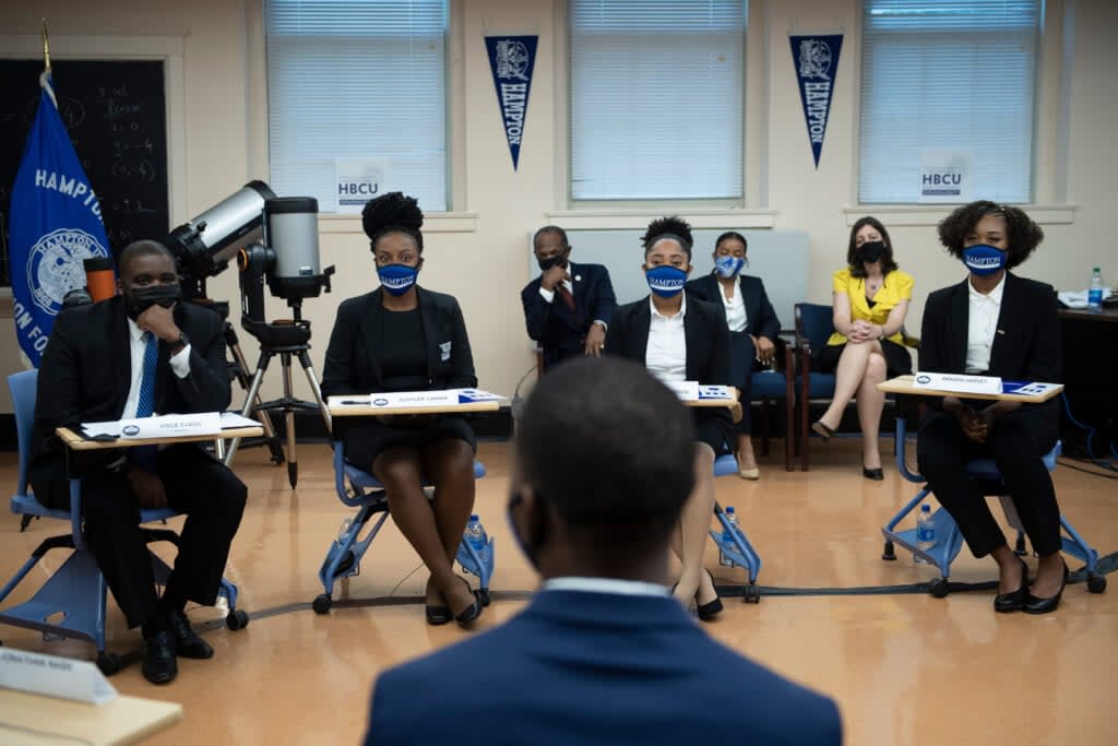 Students and others listen during a discussion with US Vice President Kamala Harris as she tours Hampton University during a visit highlighting Historically black colleges and universities (HBCU) and science, technology, engineering, and mathematics (STEM) programs on September 10, 2021, in Hampton, Virginia. (Photo by Brendan Smialowski / AFP) (Photo by BRENDAN SMIALOWSKI/AFP via Getty Images)