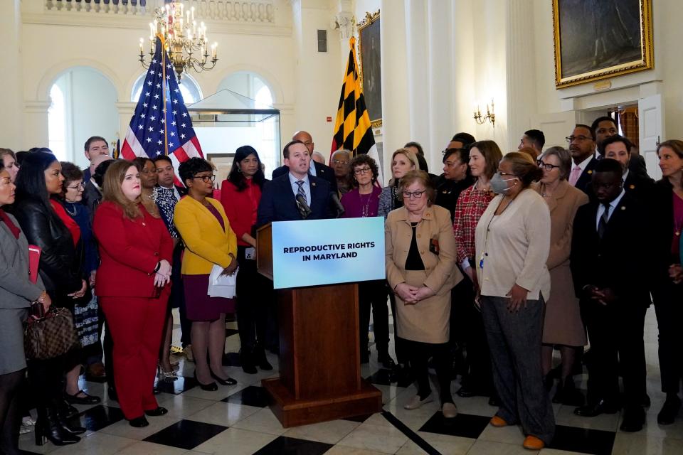 Maryland Senate President Bill Ferguson, D-Baltimore, center, stands at the podium with lawmakers during a news conference at the statehouse, Thursday, Feb. 9, 2023, in Annapolis, Maryland. State lawmakers announced support for measures protecting abortion rights, including a state constitutional amendment that would enshrine it.