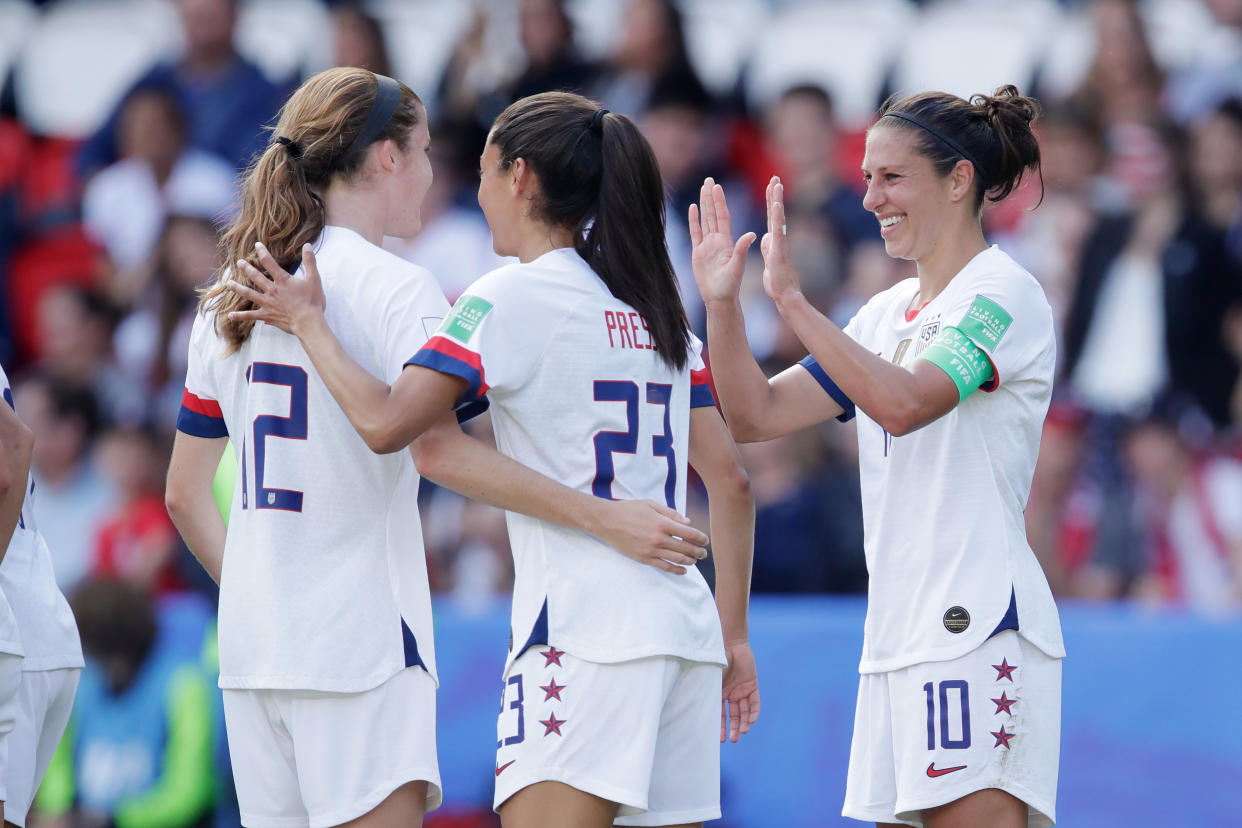 PARIS, FRANCE - JUNE 16: Carli Lloyd of USA Women Celebrates with Tierna Davidson of USA Women, Christen Press of USA Women  during the  World Cup Women  match between USA  v Chile  at the Parc des Princes on June 16, 2019 in Paris France (Photo by Eric Verhoeven/Soccrates/Getty Images)