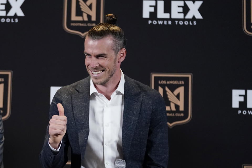 FILE - Gareth Bale gives a thumbs-up as he is introduced as a new member of the Los Angeles FC MLS soccer club Monday, July 11, 2022, in Los Angeles. Gareth Bale feels fitter and happier since joining MLS team Los Angeles FC and is hoping that helps his performances for Wales going into the World Cup. Bale chose to move to the United States to get the most out of the final years of his career for club and country after some tough times at Real Madrid. (AP Photo/Marcio Jose Sanchez, File)