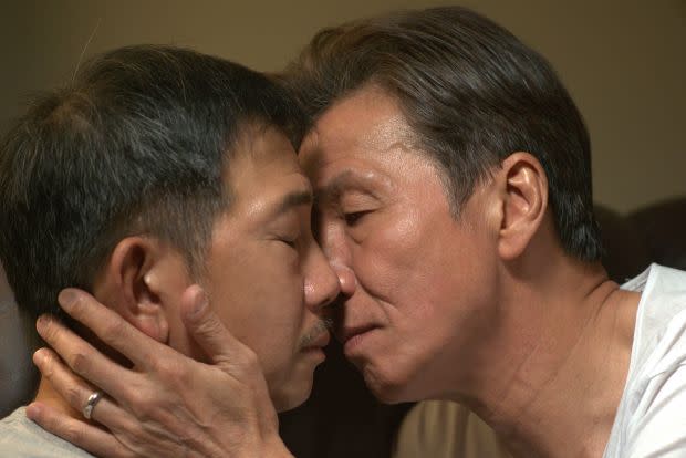Forbidden love: elderly gay lovers Hoi (left) and Pak share an intimate moment in secret in 'Suk Suk".