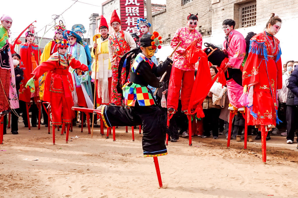 People walk on stilts to celebrate the Lantern Festival in Chengguan town, Hua County, Anyang city, in Henan province, China, on Feb. 24, 2024. <span class="copyright">CFOTO-Future Publishing/Getty Images</span>