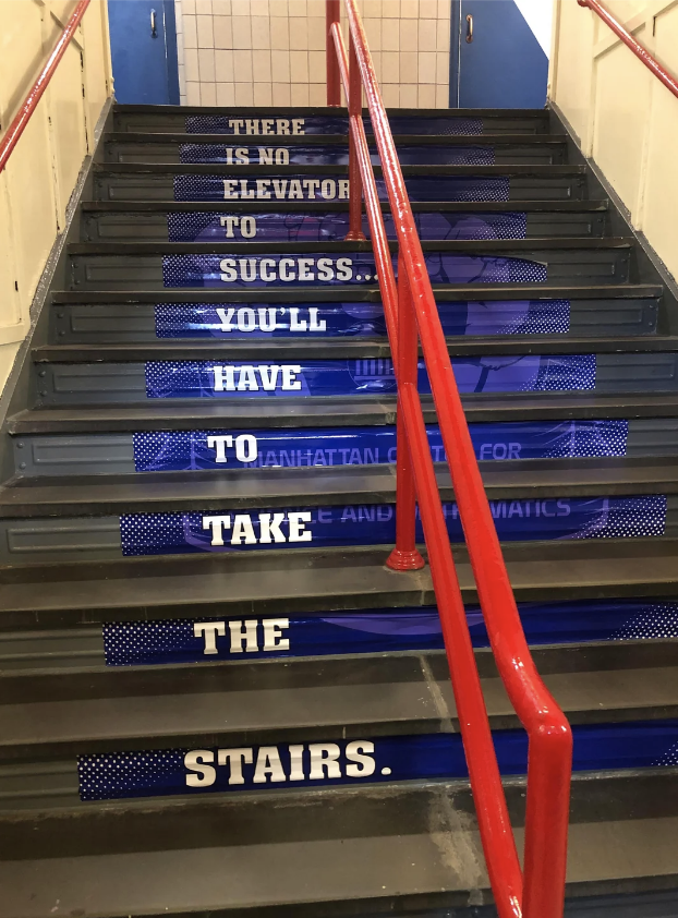 A staircase with a motivational message: "There is no elevator to success. You'll have to take the stairs."