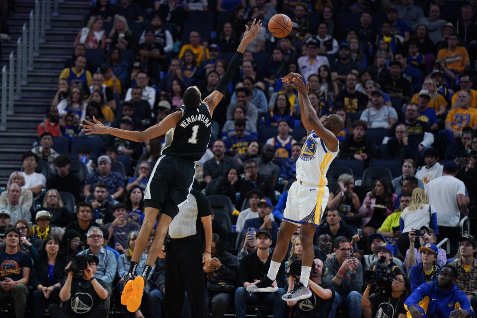 TOPSHOT - San Antonio Spurs' French forward-center #01 Victor Wembanyama attempts to block a shot by Golden State Warriors' US guard #03 Chris Paul during the NBA preseason game between the San Antonio Spurs and Golden State Warriors at Chase Center in San Francisco, California on October 20, 2023. (Photo by Loren Elliott / AFP) (Photo by LOREN ELLIOTT/AFP via Getty Images)