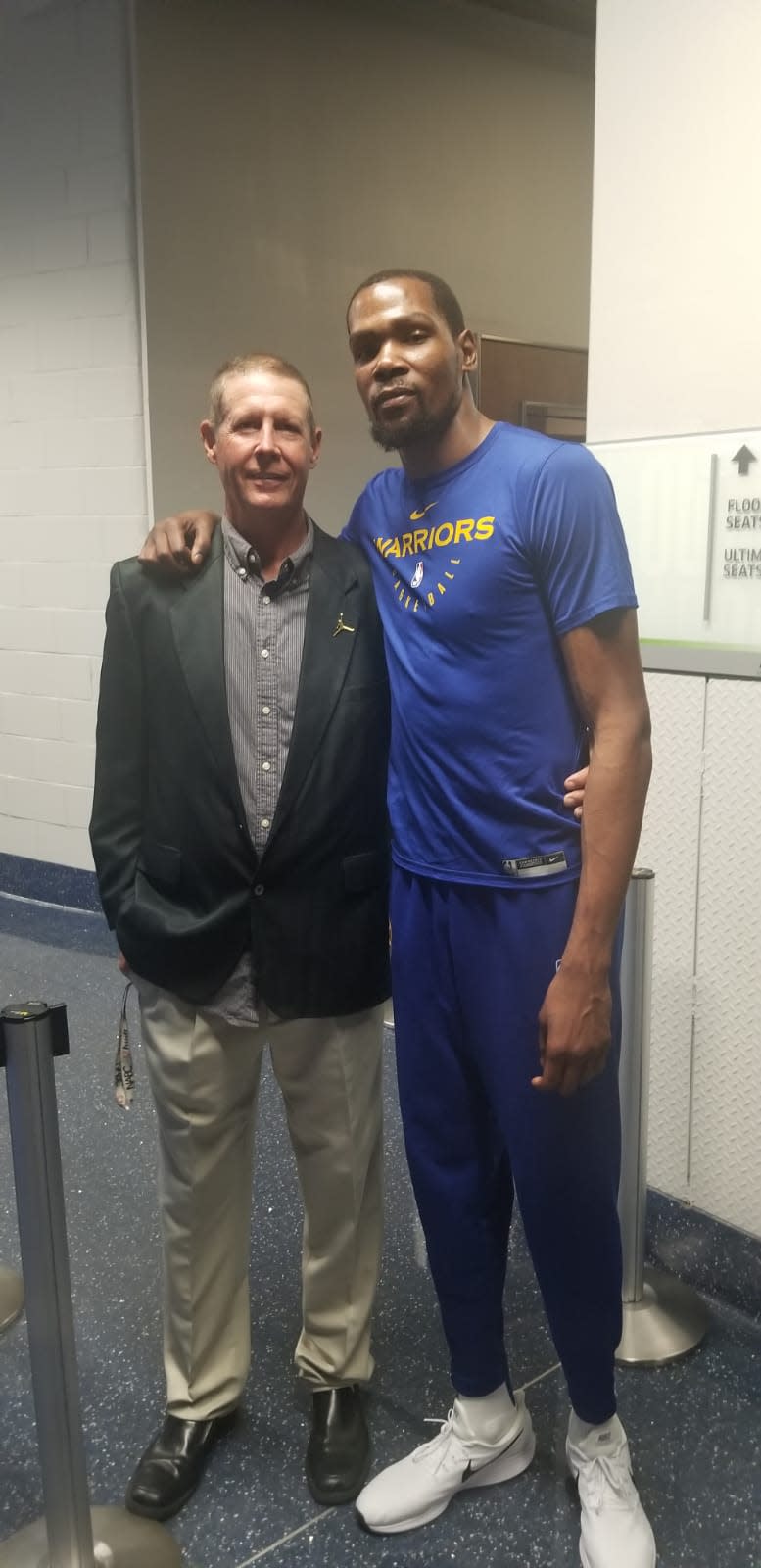 Rick Walrond, a former assistant basketball coach at Stetson and Bethune-Cookman, stands with NBA superstar Kevin Durant. Walrond sometimes brings former professional players — like Audie Norris and Clemon Johnson — with him to camps.