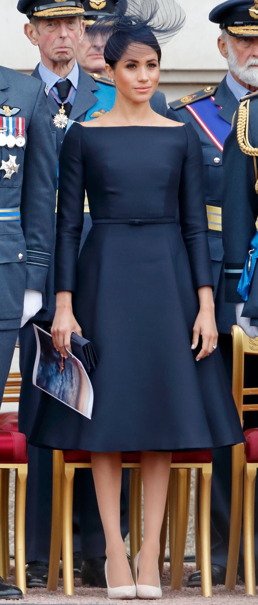 Meghan, Duchess of Sussex attends a ceremony to mark the centenary of the Royal Air Force on the forecourt of Buckingham Palace on July 10, 2018 in London, England. The 100th birthday of the RAF, which was founded on on 1 April 1918, was marked with a centenary parade with the presentation of a new Queen's Colour and flypast of 100 aircraft over Buckingham Palace