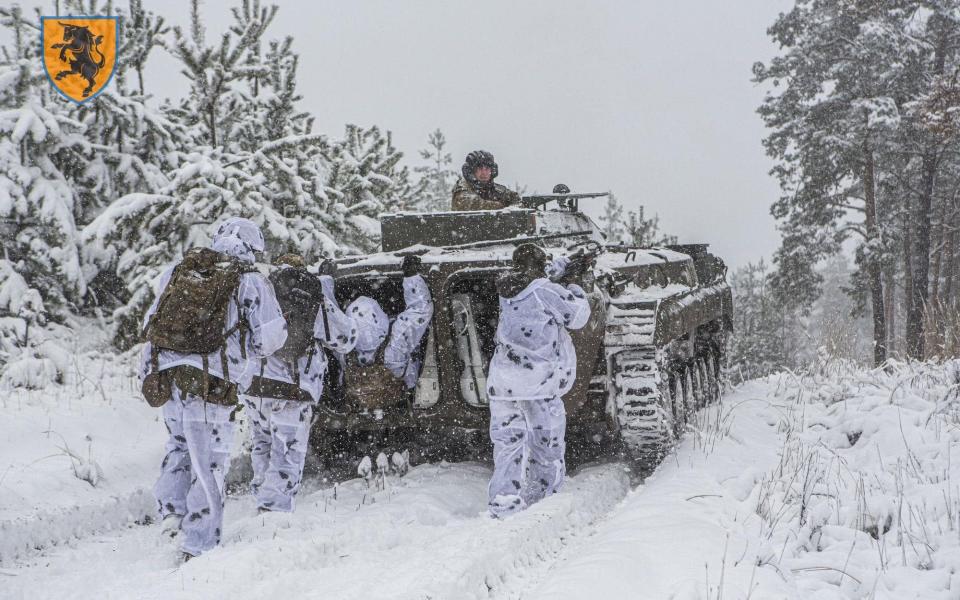 Ukrainian soldiers are seen wearing snow suits as winter sets in