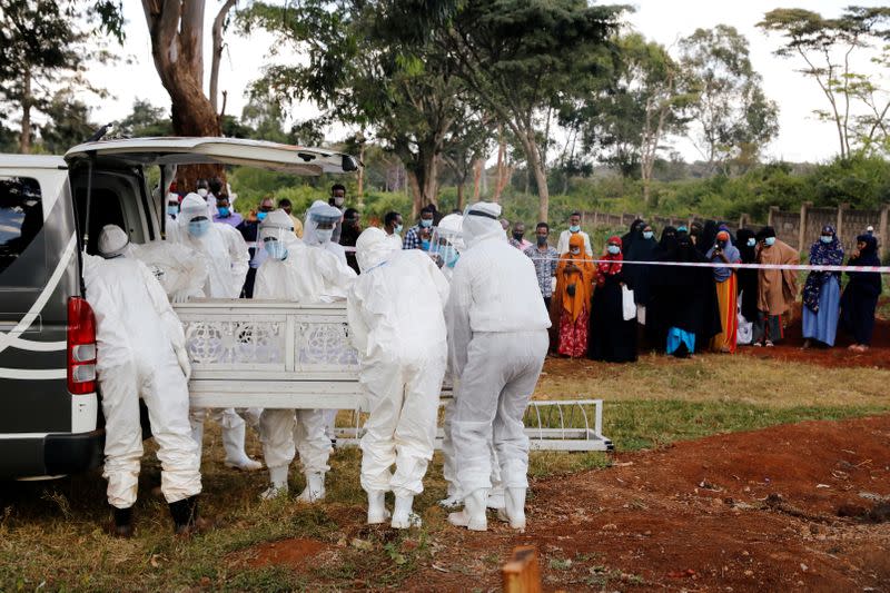 FILE PHOTO: Volunteers from the National Muslim Covid-19 Response Committee work at the muslim cemetery in Nairobi