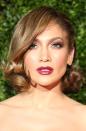 The sexy singer wore her newly-cropped hair into a curled bob at the 2015 Tony Awards and mixed up her typically bronze makeup for a deep plump plum lip and matching shimmery shadow.