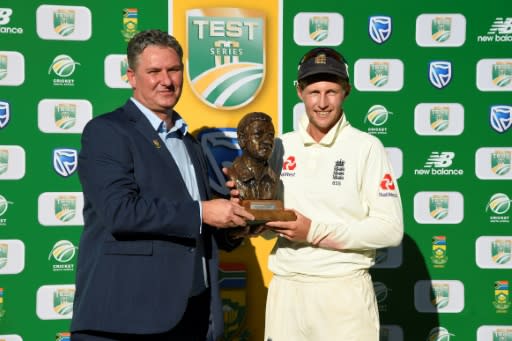 England captain Joe Root (R) receives the Basil D'Oliveira trophy after a 3-1 series win over South Africa