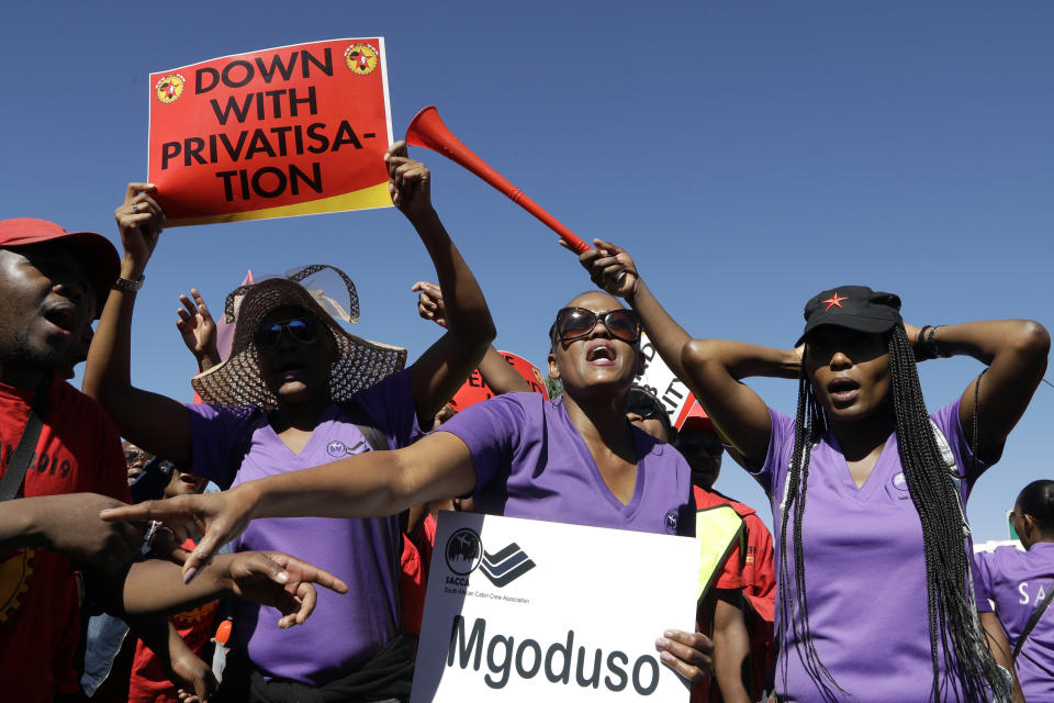 South African Cabin Crew Association and the National Union of Metalworkers members picket at the SAA Airways Park in Kempton Park, South Africa, Friday, Nov. 15, 2019. South Africa's troubled state-owned airline has begun canceling flights after two unions announced their workers would go on strike to protest nearly 1,000 expected job cuts. (AP Photo/Themba Hadebe)