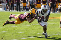 Arizona wide receiver Stanley Berryhill III runs away from Arizona State defensive back Chase Lucas (24) in the first half during an NCAA college football game, Saturday, Nov. 27, 2021, in Tempe, Ariz. (AP Photo/Rick Scuteri)