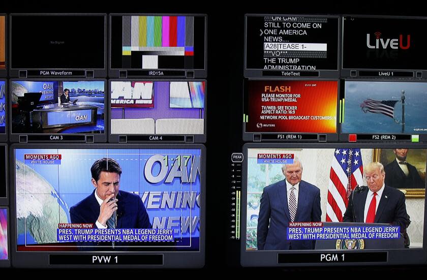 Screens show different segments for a nightly news segment in the control room at the San Diego based One America News on Sept. 5, 2019. Host, Patick Hussion is shown on the bottom left screen.