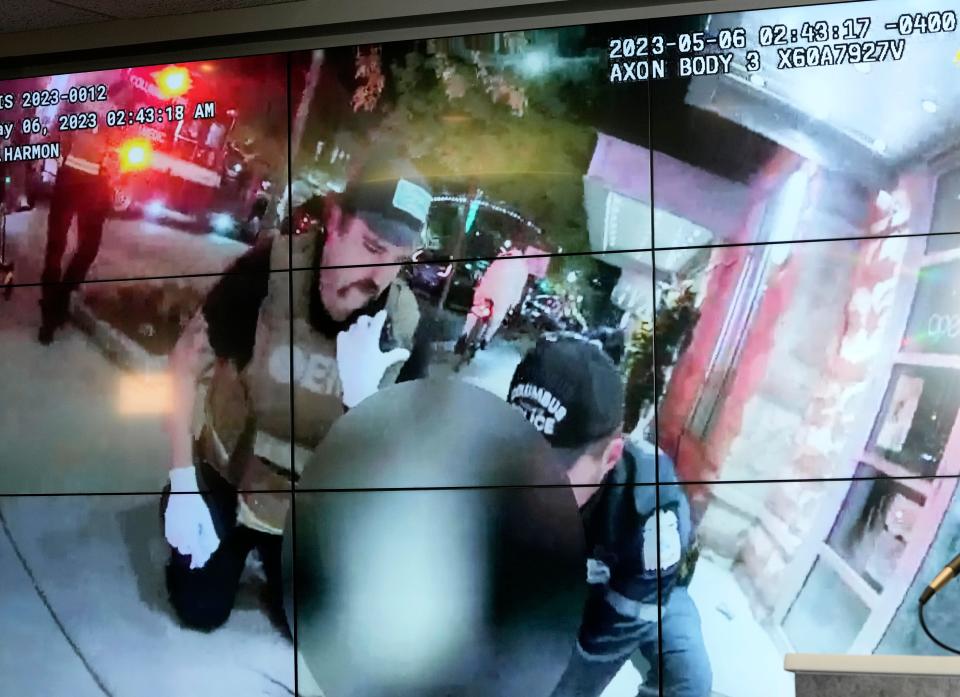 A screen shot from body camera footage released Monday at a press conference shows Columbus police officers and Columbus Fire medics attending to a person shot early Saturday morning in the 600 block of North High Street. Ten people were wounded by gunfire, including one critically. The incident is being investigated by the Ohio Bureau of Criminal Investigation.