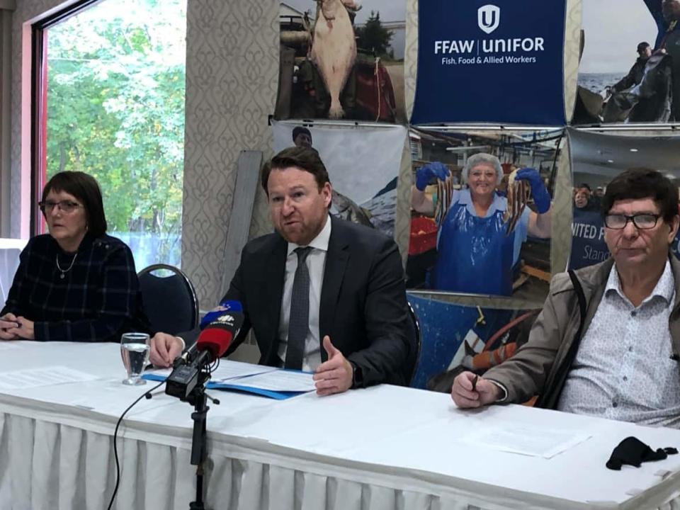 FFAW president Keith Sullivan, middle, spoke at a small press conference in Corner Brook Thursday, saying the federal government is favouring the corporate sector when it comes to quota allocations with the impending redfish fishery. (Colleen Connors/CBC  - image credit)