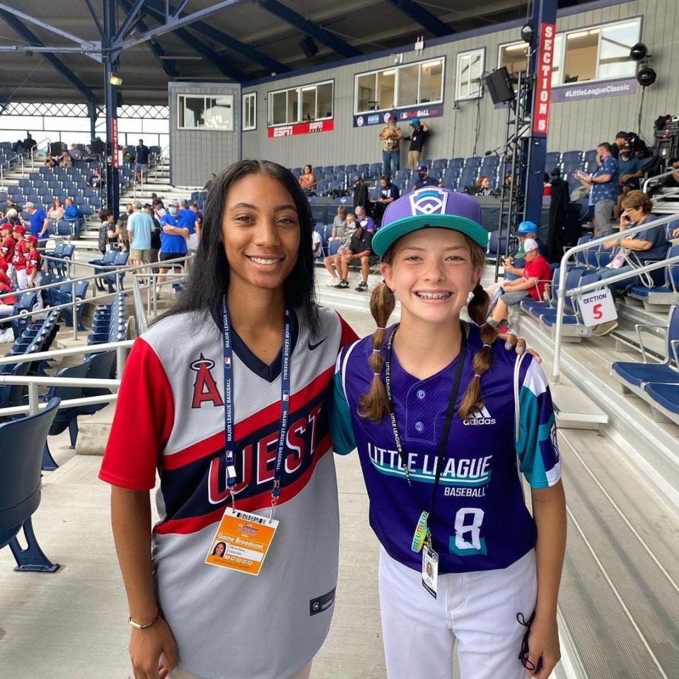 Wylie's Ella Bruning, right, poses with Mo'ne Davis, who was an in-game analyst for ESPN's KidCast. Davis played for a Philadelphia team in the 2014 Little League World Series. Davis threw out the ceremonial first pitch to Bruning before one of the games last year.