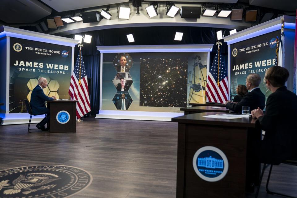 President Biden listens during a briefing from NASA officials