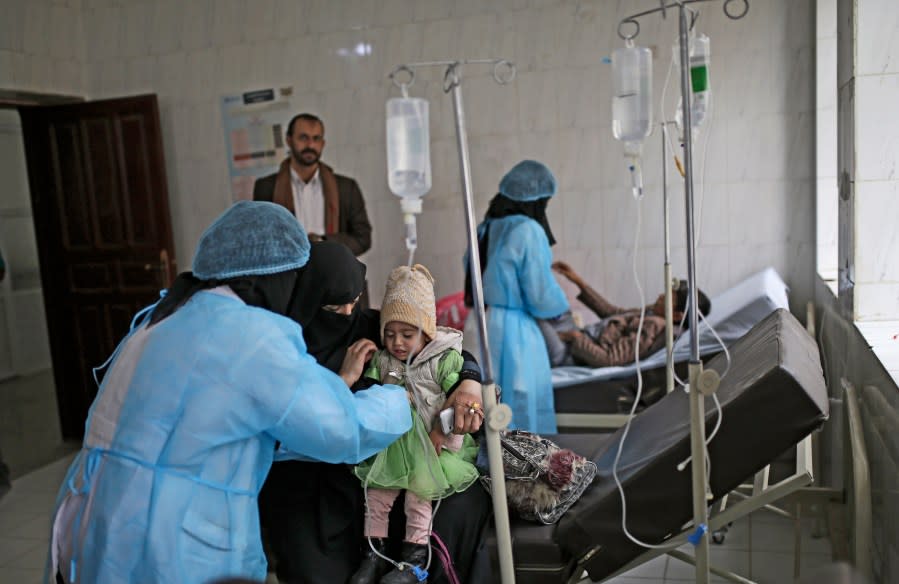 A girl, centre, suspected of cholera infection is treated at a hospital in Sanaa, Yemen, Monday, Sept. 9, 2019.The World Health Organization and UNICEF launched a diphtheria vaccination campaign this month in war-torn Yemen targeting over 2.8 million children between the ages of six weeks and 15 years. (AP Photo/Hani Mohammed)