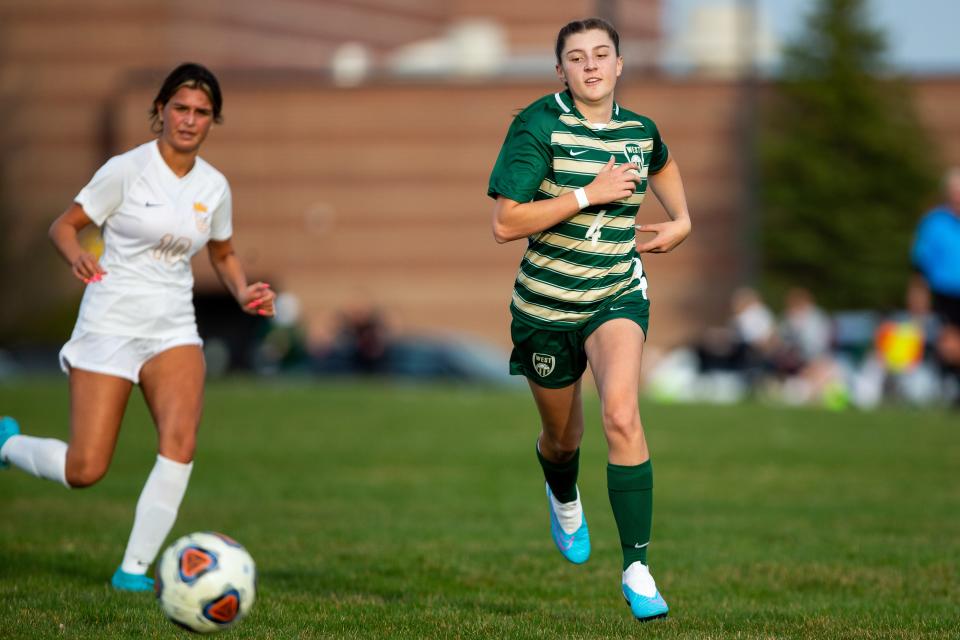 West's Rylee Smith runs down the field during a game against East Tuesday, April 11, 2023, at Zeeland West. 