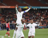 FILE - Zambia's Racheal Kundananji, bottom, carries teammate Barbra Banda as the celebrate the final goal of the match with Zambia's Mary Wilombe, right, during the Women's World Cup Group C soccer match between Costa Rica and Zambia in Hamilton, New Zealand, Monday, July 31, 2023. The group stage was the source of enormous national pride for Portugal, the Philippines, Vietnam, Panama, Ireland, Haiti, Zambia and Morocco, all newcomers to the highest level of international women's soccer. (AP Photo/Juan Mendez,File)