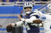 Dallas Cowboys quarterback Dak Prescott (4) is pressured during the first half of an NFL football game against the Detroit Lions, Sunday, Nov. 17, 2019, in Detroit. (AP Photo/Rick Osentoski)