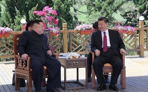 Kim Jong-un and Xi Jinping meet in Dalian - Credit: Xinhua/Ju Peng