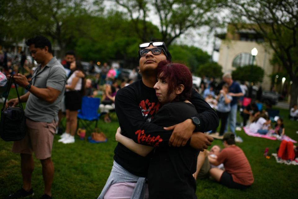 Boerne, Texas: A couple hugs as clouds cover the eclipse  on April 8, 2024 in Boerne, Texas. Mark Felix/The Texas Tribune