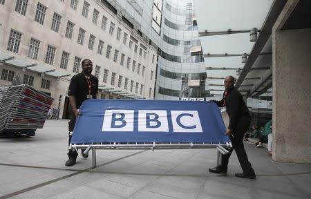 BBC workers place barriers near to the main entrance of the BBC headquarters and studios in Portland Place, London, Britain, July 16, 2015. REUTERS/Peter Nicholls/File Photo