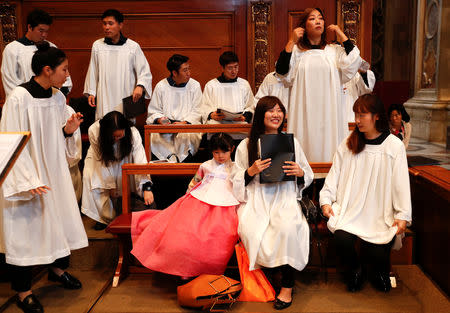 Korean members of the choir are seen before the start of a special mass for peace in the Korean peninsula led by Italian cardinal Pietro Parolin in Saint Peter's Basilica at the Vatican, October 17, 2018. REUTERS/Max Rossi