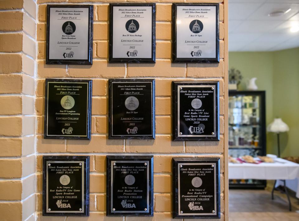 Awards from the former Lincoln College broadcasting program hang on a wall in Pritchard Hall, the headquarters of WEUR and ECTV, the radio and television stations now operating at Eureka College.