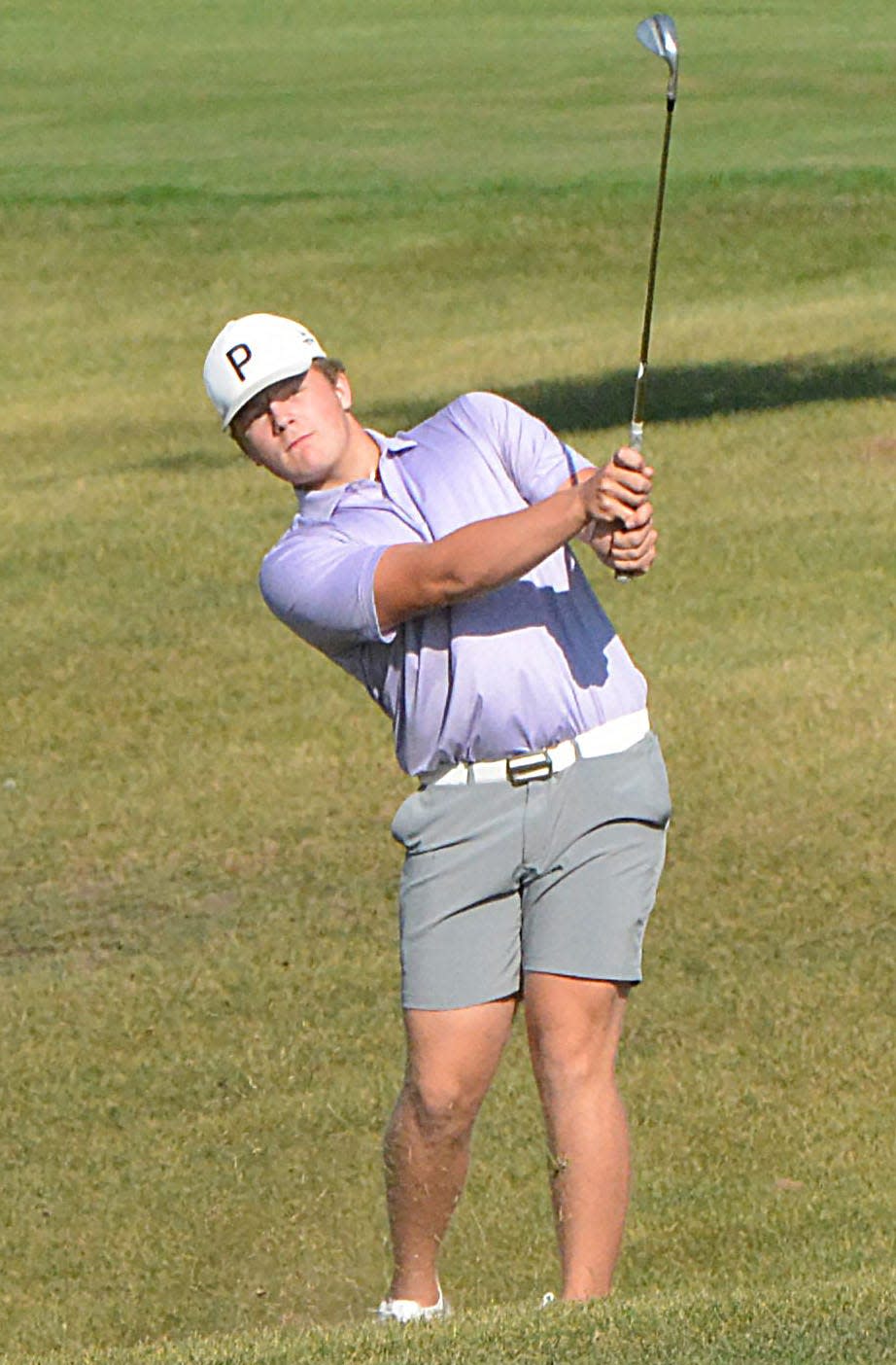 Watertown's Kaden Rylance follows through after hitting an approach shot on No. 1 Red during the Watertown Boys Golf Invitational on Tuesday, Sept. 19, 2023 at Cattail Crossing Golf Course.