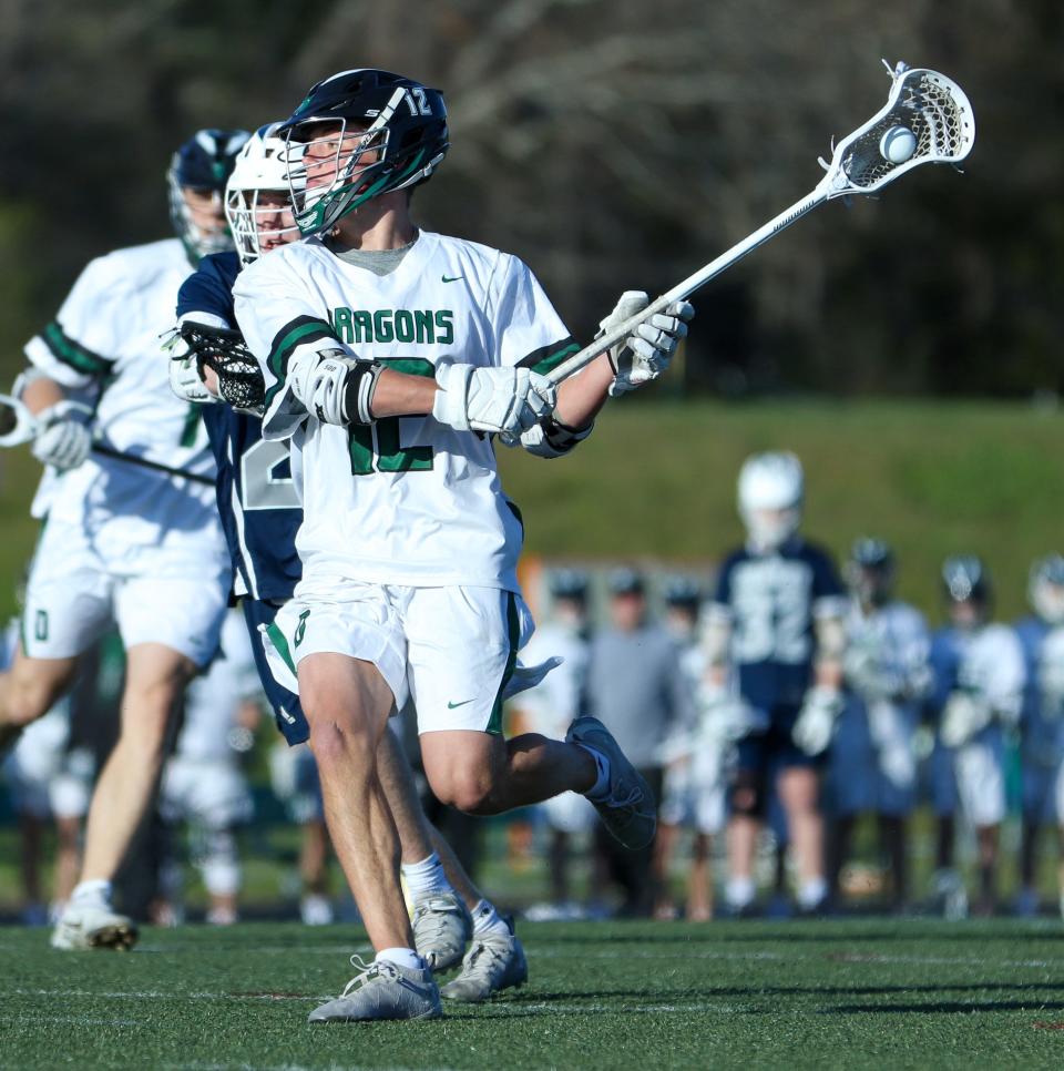 Duxbury's Sam Wein flings the ball during a game against Cohasset on Thursday, April 28, 2022.