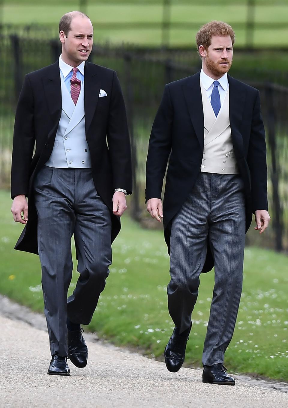 <p>The two Princes arrived in extremely similar looks with William in a blue waistcoat and Harry opting for a light grey one. (Photo: PA) </p>