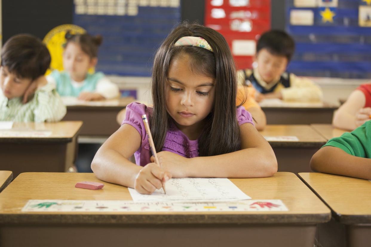 How school attendance zones are drawn can affect segregation. <a href="https://www.gettyimages.com/detail/photo/mixed-race-student-studying-at-desk-in-classroom-royalty-free-image/135205439" rel="nofollow noopener" target="_blank" data-ylk="slk:Ariel Skelley/DigitalVision Collection/Getty Images;elm:context_link;itc:0;sec:content-canvas" class="link ">Ariel Skelley/DigitalVision Collection/Getty Images</a>