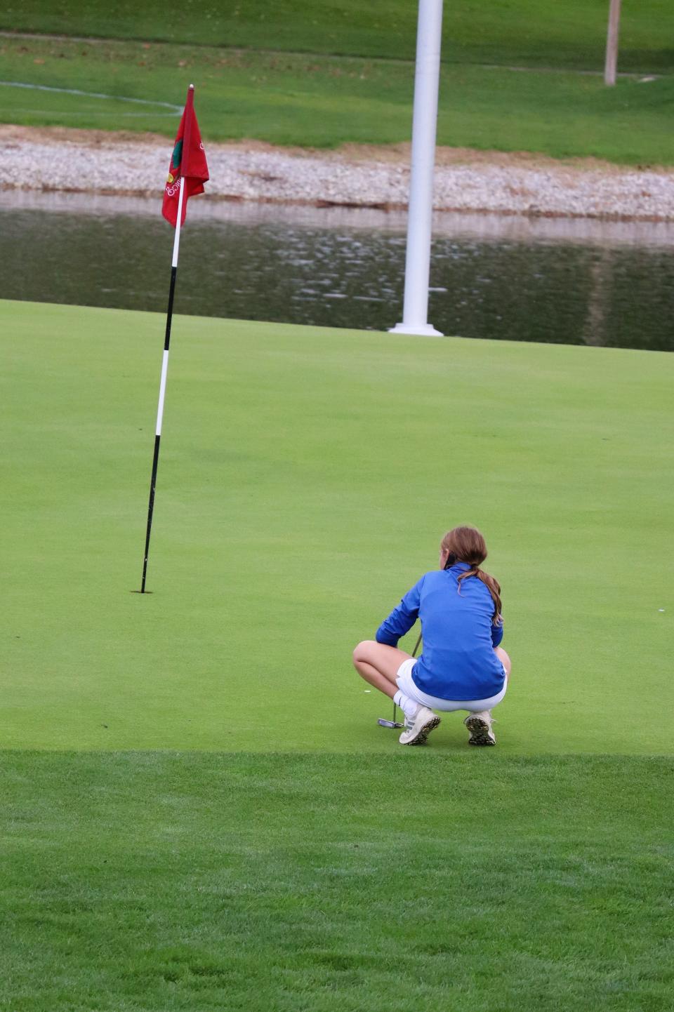 Wynford's Caroline Sheldon reads the green on the 5th hole at Sycamore Springs in the Division II district golf tournament.