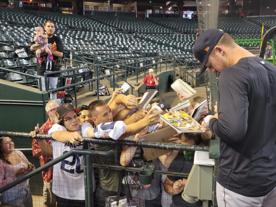 Detroit Tigers player Spencer Torkelson signs items for fans before facing the Arizona Diamondbacks at Chase Field on June 24, 2022.