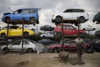 A man works in a scrapyard at a recycling company in the town of Elefsina, near Athens, Greece June 30, 2015. REUTERS/Marko Djurica