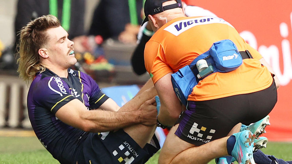 Seen here, Ryan Papenhuyzen is attended to after being injured in the Storm's 42-6 win over the Dragons.