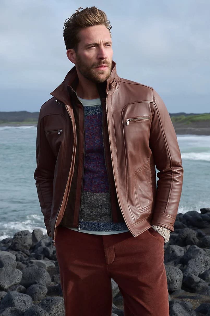 Warm cognac brown high collar moto jacket on model