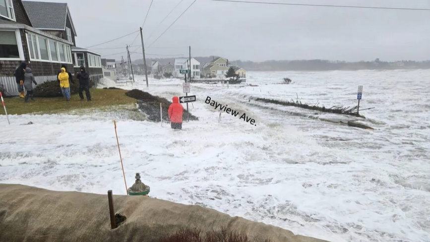 Residents monitor seaside homes at Higgins Beach in Scarborough during the Jan. 13 storm, as waves threaten. Real estate agents are coming to terms with how to market coastal properties as stronger storms become more common. Photo courtesy the Maine Geological Survey.