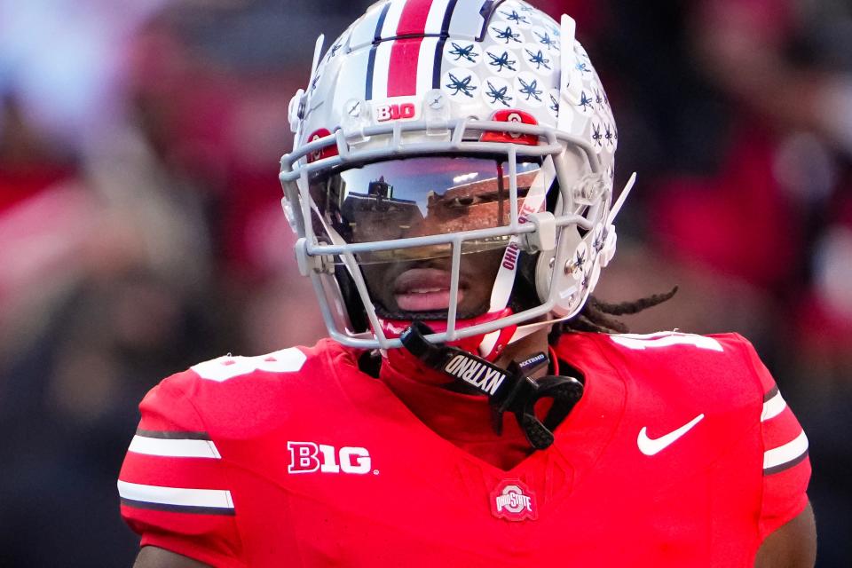 Ohio State Buckeyes wide receiver Marvin Harrison Jr. (18) warms up prior to the NCAA football game against the Minnesota Golden Gophers at Ohio Stadium in Columbus on Nov. 18, 2023.