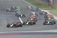 Red Bull driver Max Verstappen of the Netherlands, left, leads the field after the start during the Chinese Formula One Grand Prix at the Shanghai International Circuit, Shanghai, China, Sunday, April 21, 2024. (AP Photo/Andy Wong)