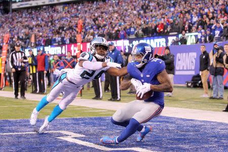 Dec 20, 2015; East Rutherford, NJ, USA; New York Giants wide receiver Odell Beckham Jr. (13) catches a touchdown pass in front of Carolina Panthers corner back Josh Norman (24) during the fourth quarter at MetLife Stadium. The Panthers defeated the Giants 38-35. Mandatory Credit: Brad Penner-USA TODAY Sports