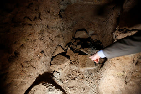 Archaeologist Musab Mohammed Jassim shows artefacts and archaeological pieces in a tunnel network running under the Mosque of Prophet Jonah, Nabi Yunus in Arabic, in eastern Mosul, Iraq March 9, 2017. REUTERS/Suhaib Salem