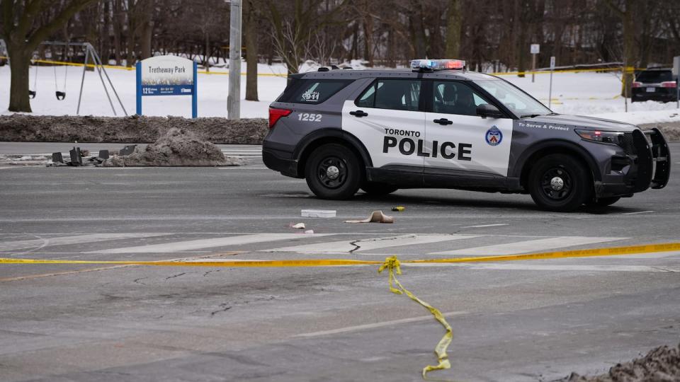 A Toronto police SUV can be seen after a police shooting on Feb. 27. In a news release Friday, the SIU said a police constable is facing charges under the criminal code. (Paul Smith/CBC - image credit)