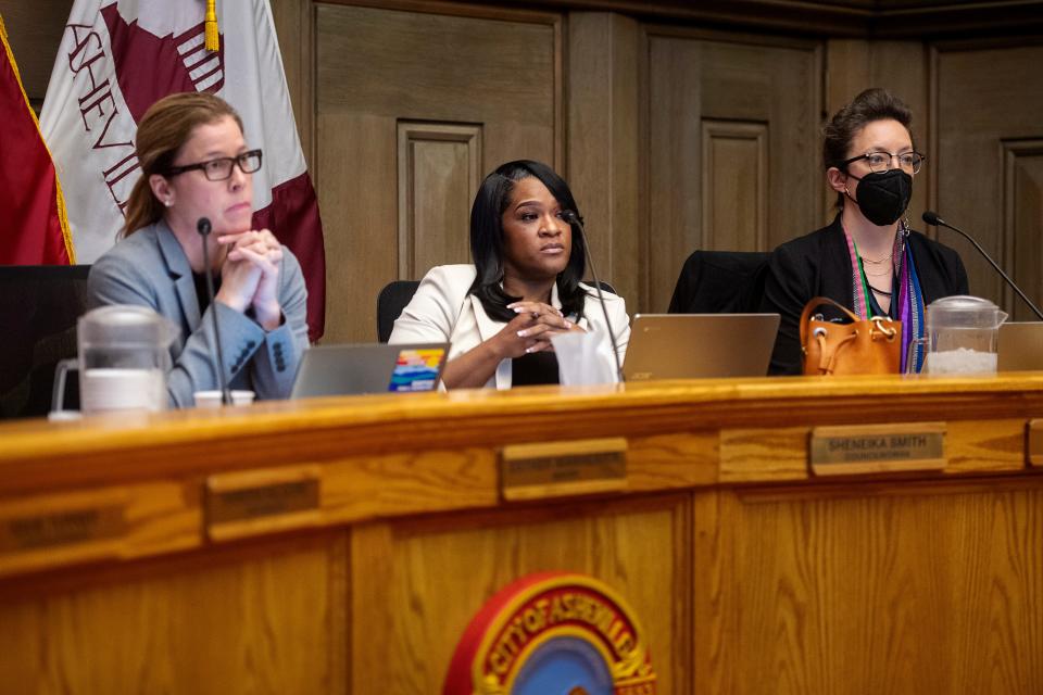 Mayor Esther Manheimer, left, and council members Sheneika Smith, center, and Kim Roney listen during an Asheville City Council meeting, January 10, 2023, which addressed the water outages that impacted thousands the previous month.