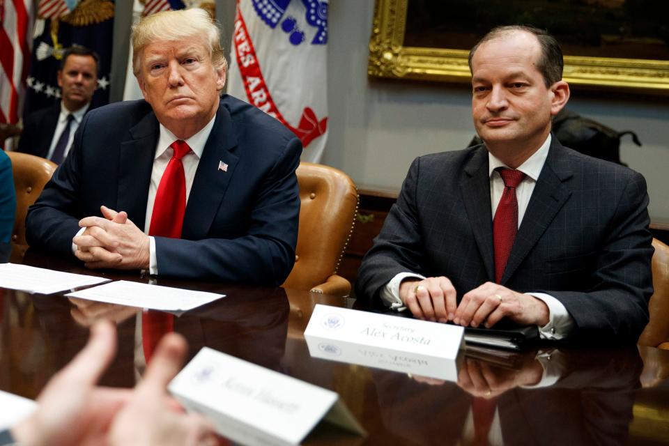 President Donald Trump, left, and Labor Secretary Alexander Acosta listen during a meeting of the President's National Council of the American Worker in the Roosevelt Room of the White House in Washington, Sept. 17, 2018.